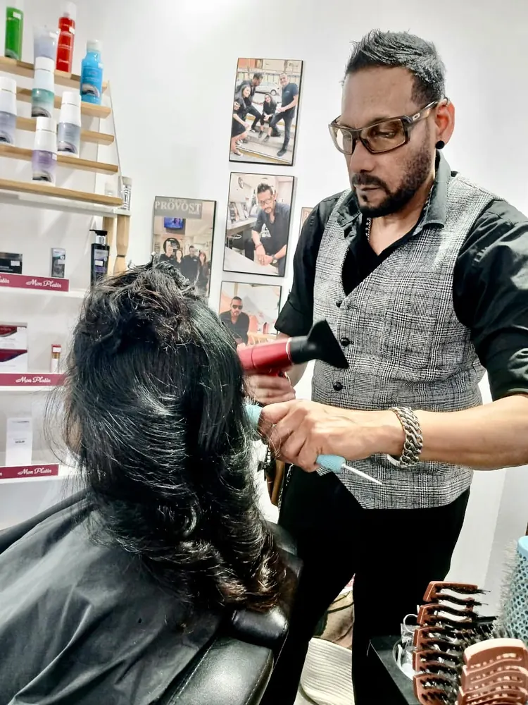 Kris at work in his hair salon